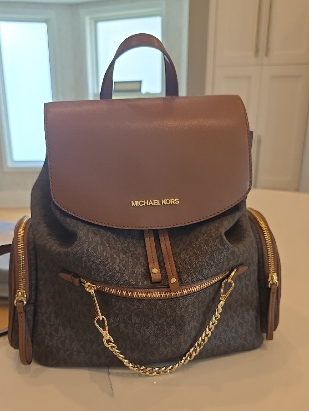 Michael Kors Brown Logo Backpack with Gold Chain Accent